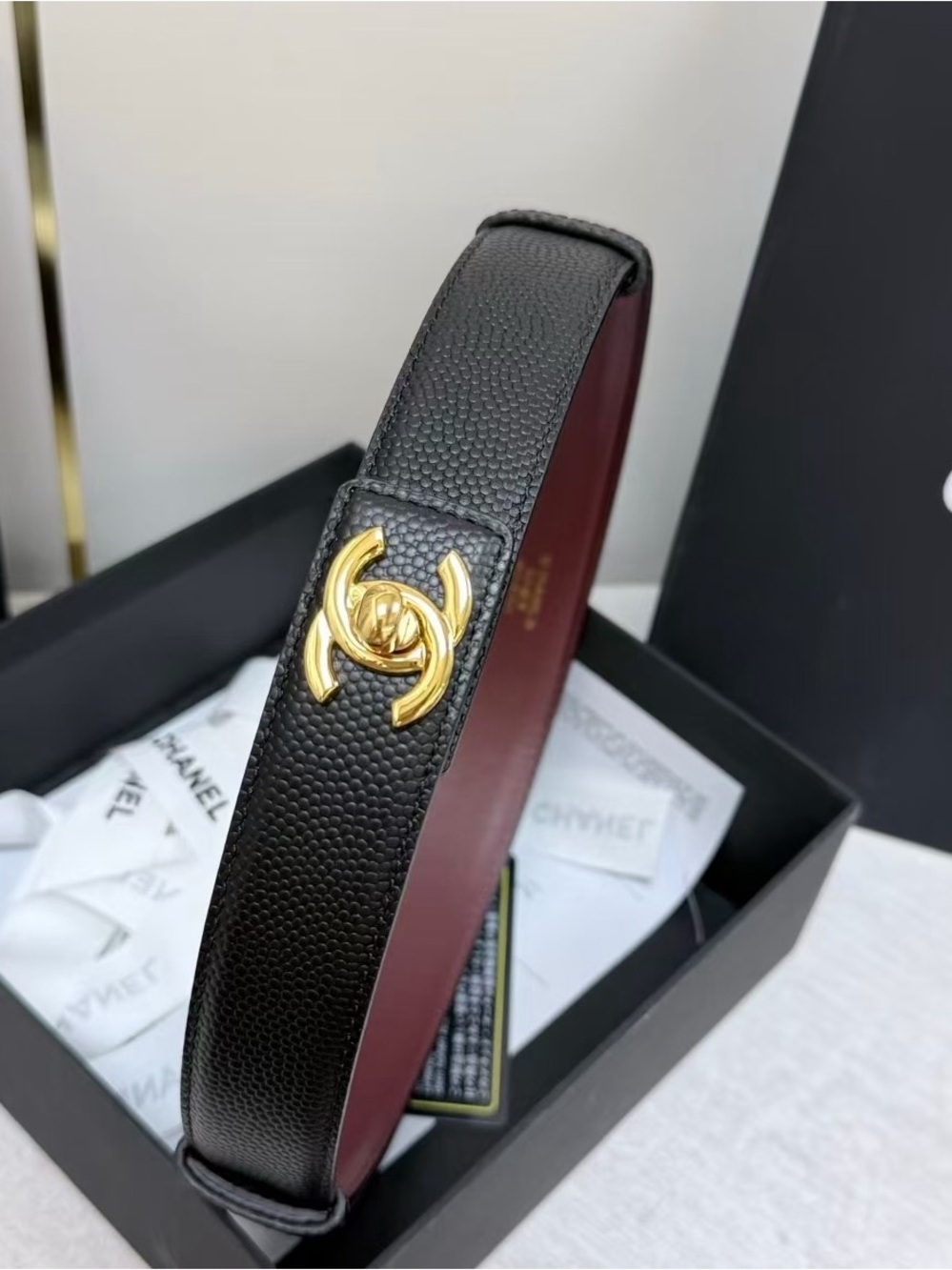 CHANEL Black Leather Headband with Gold Accent